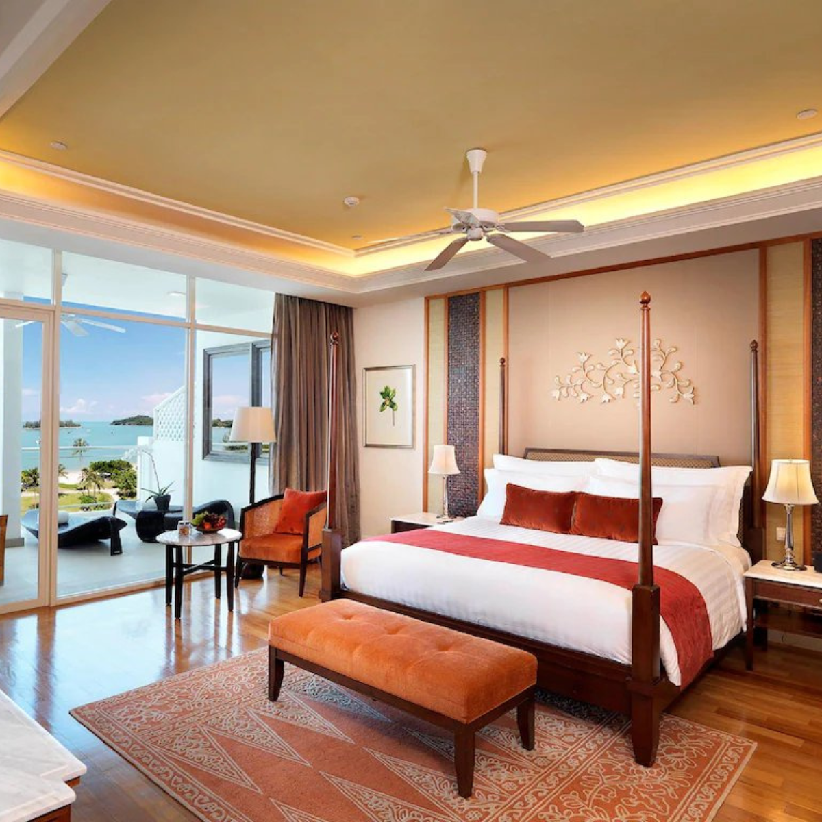 Ocean View Suite with four-poster bed and balcony overlooking the bay